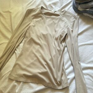 A fitted long sleeve top that is size extra small by the brand yogalicious